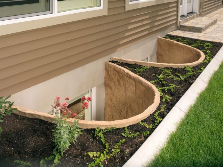 Slider egress window with a stone-look window well