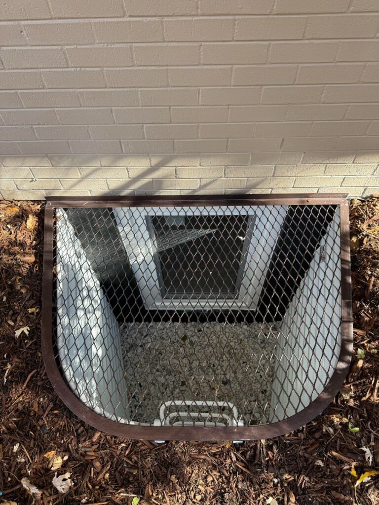 Denver Basement Egress Window Installation with Bronze Grate