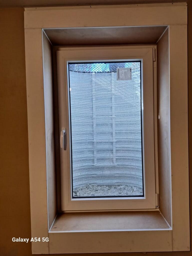 Denver Basement Egress Window Installation with Bronze Grate