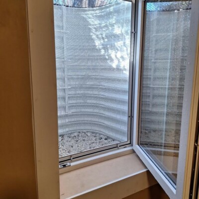 Denver Basement Egress Window Installation with Bronze Grate